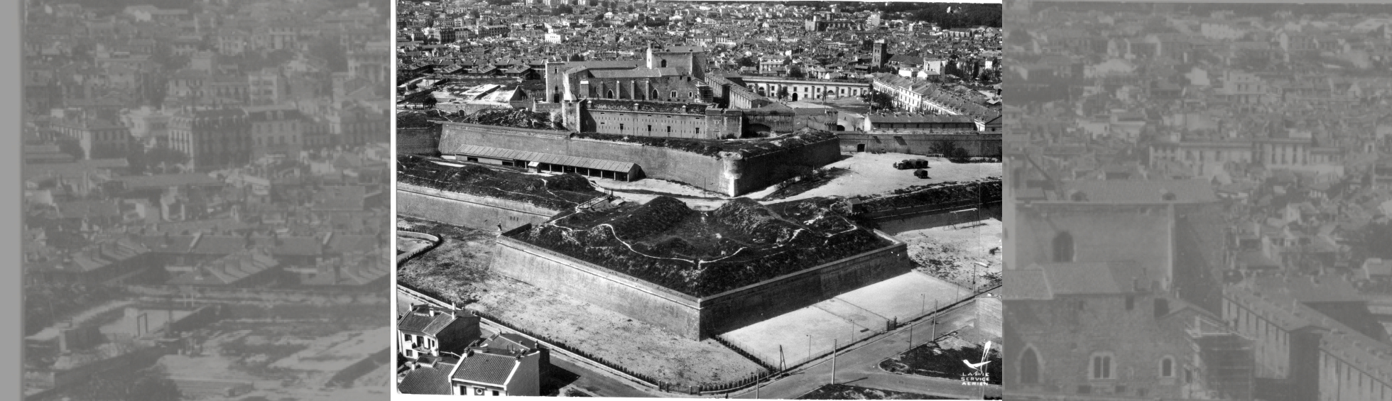 Vue aérienne avec les fortifications de Philippe II et un début de construction après la démolition des remparts sud